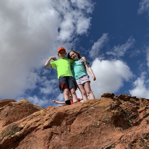 Ollie and Mae on the red rocks of Snow Canyon